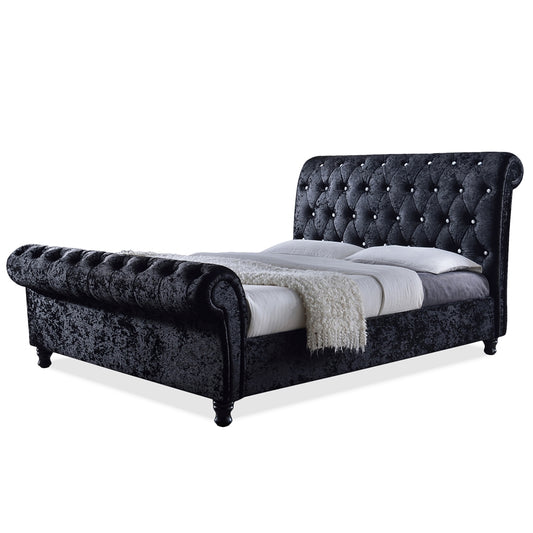 Baxton Studio Castello Cama trineo tapizada en terciopelo negro con botones de cristal sintético